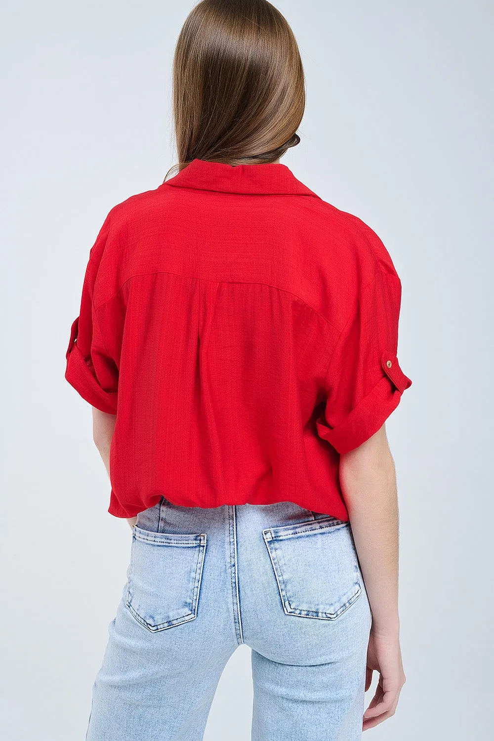 Red shirt with short sleeves and pleat on the sleeve